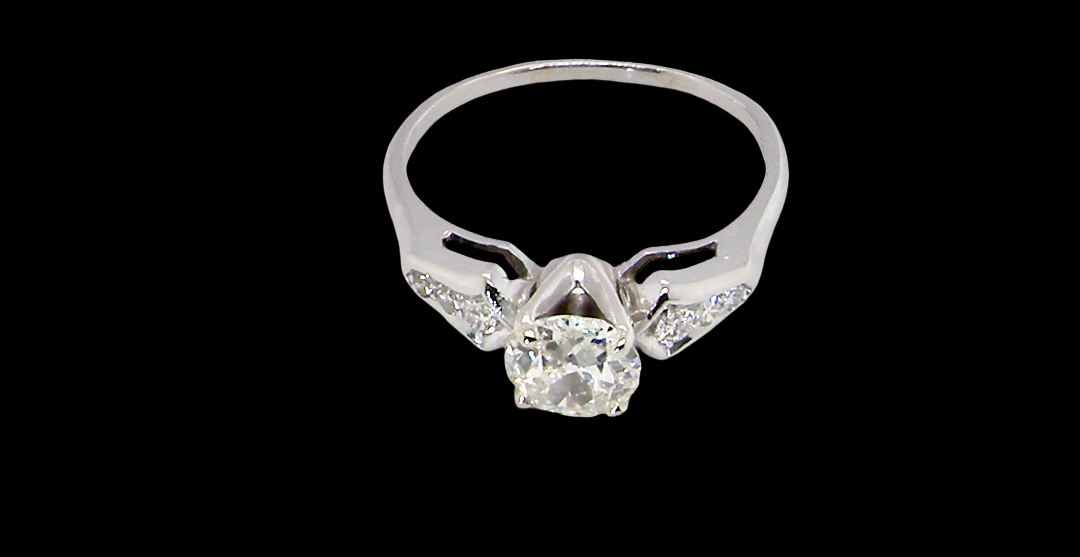 top view A fine solitaire ring featuring an e lovely brilliant cut white diamond. Measures 6.3mm (est 0.85 carats) very bright white stone, colour H-i, clarity VS. Head depth 7mm. 