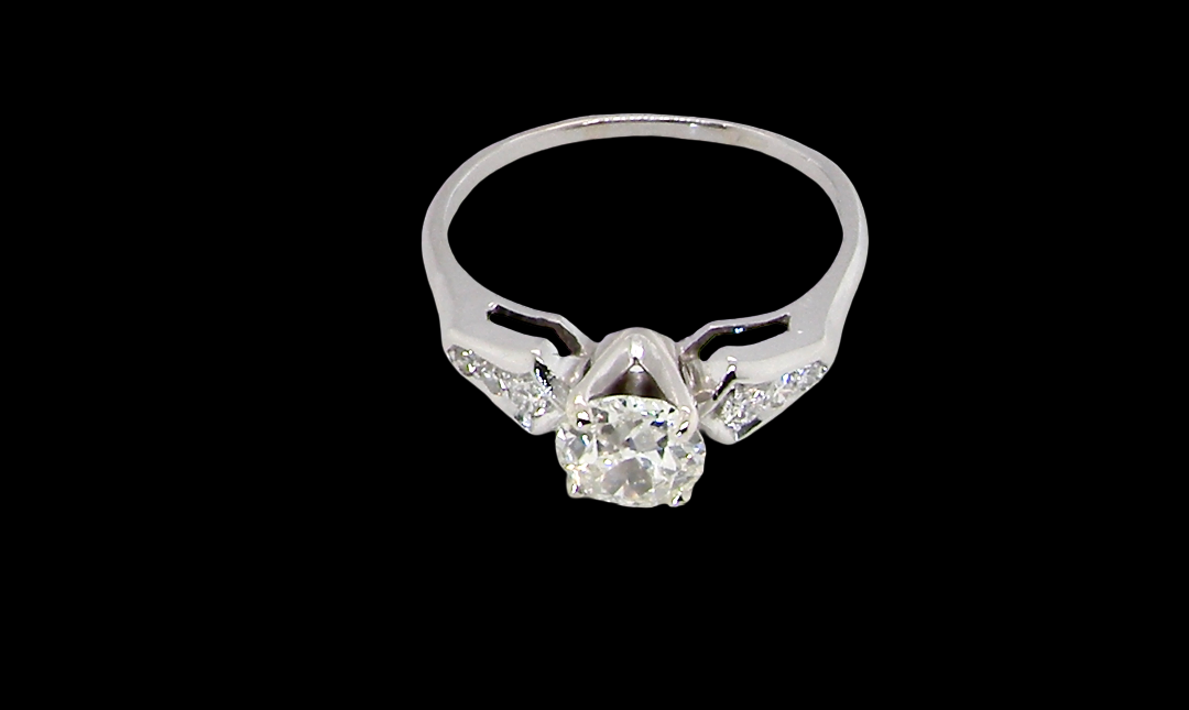 top view A fine solitaire ring featuring an e lovely brilliant cut white diamond. Measures 6.3mm (est 0.85 carats) very bright white stone, colour H-i, clarity VS. Head depth 7mm. 
