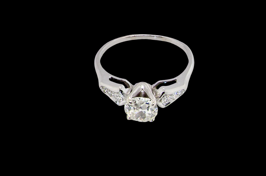 top view A fine solitaire ring featuring an e lovely brilliant cut white diamond. Measures 6.3mm (est 0.85 carats) very bright white stone, colour H-i, clarity VS. Head depth 7mm. 