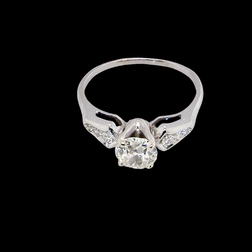 top view A fine solitaire ring featuring an e lovely brilliant cut white diamond. Measures 6.3mm (est 0.85 carats) very bright white stone, colour H-i, clarity VS. Head depth 7mm. 