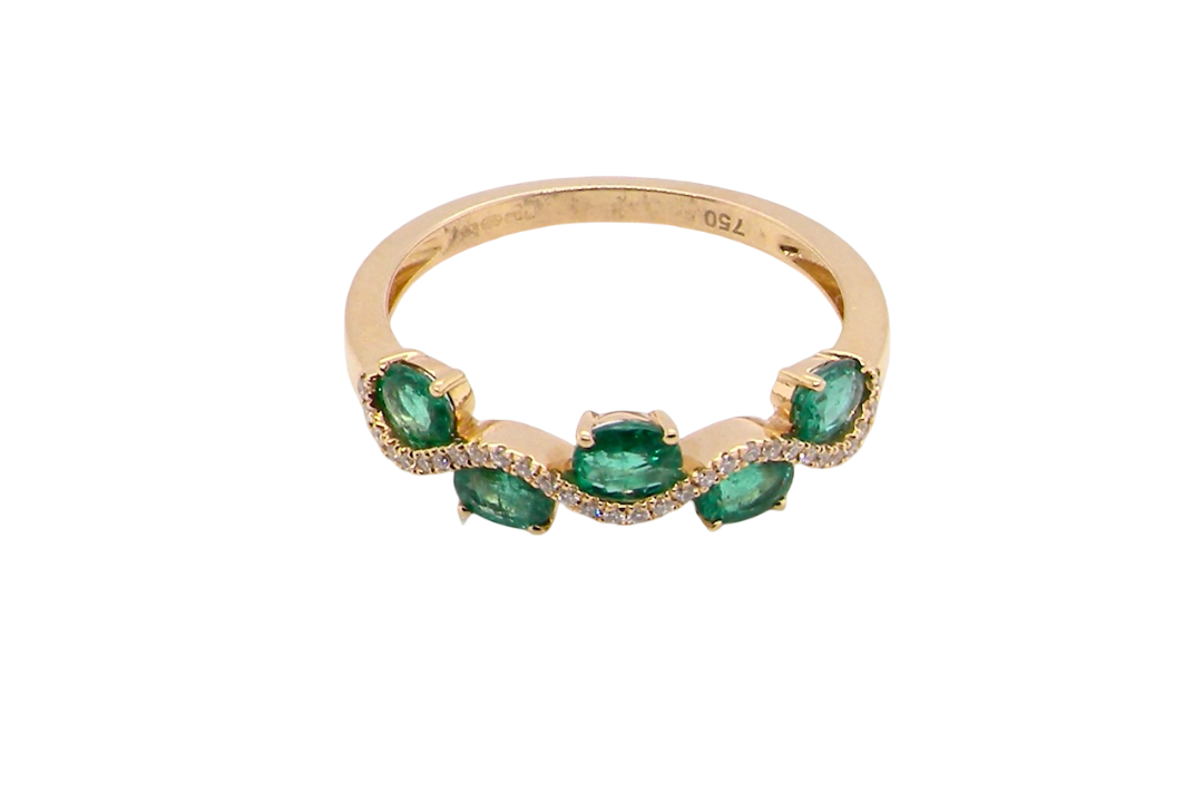 top view A half hoop ring with a very attractive line of oval cut emeralds, each 4x3mm, a lovely deep grass green hue, and with very good clarity too.