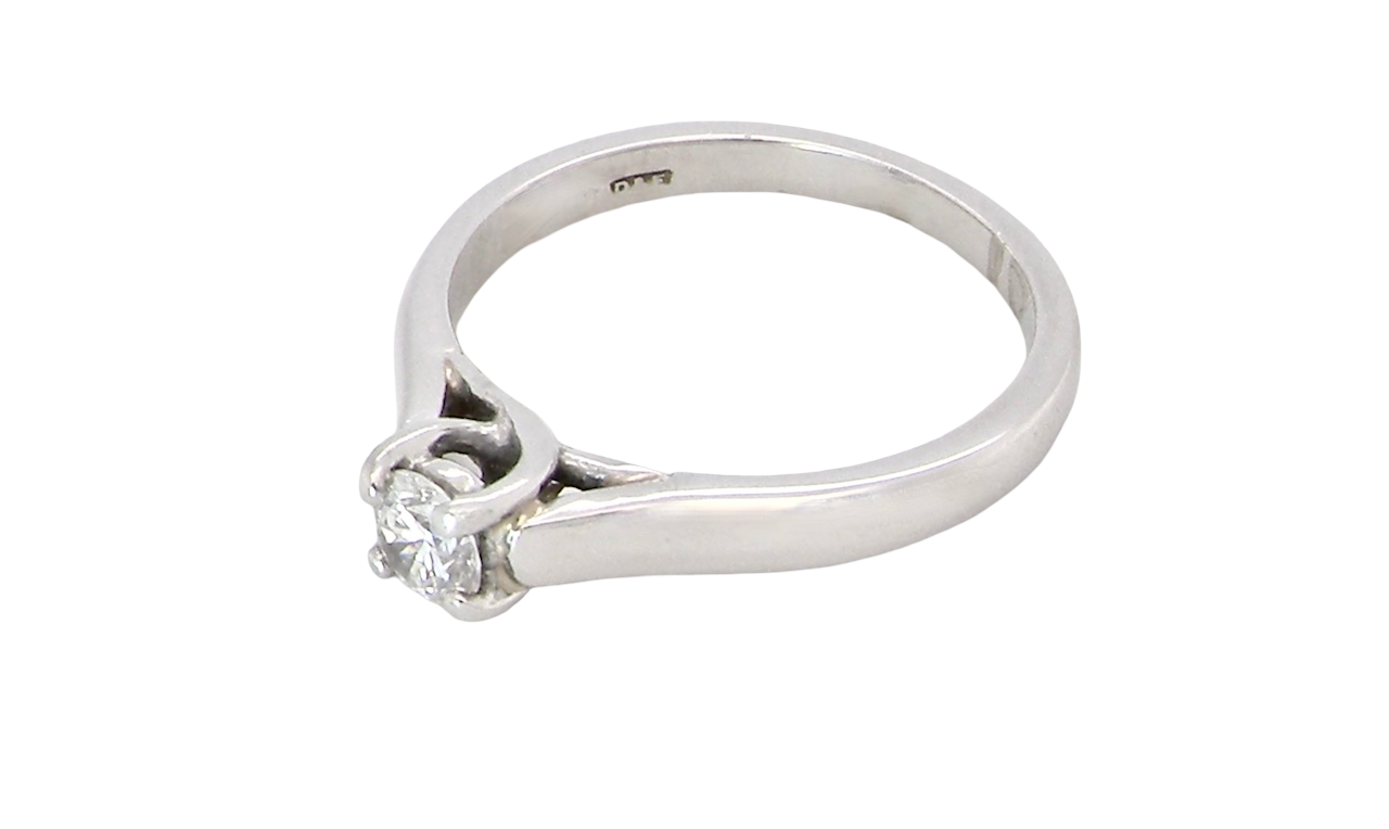 top view A single stone solitaire diamond ring. The modern brilliant cut white diamond measures 3.9mm (0.22 carats est) Colour G-h, clarity VS.