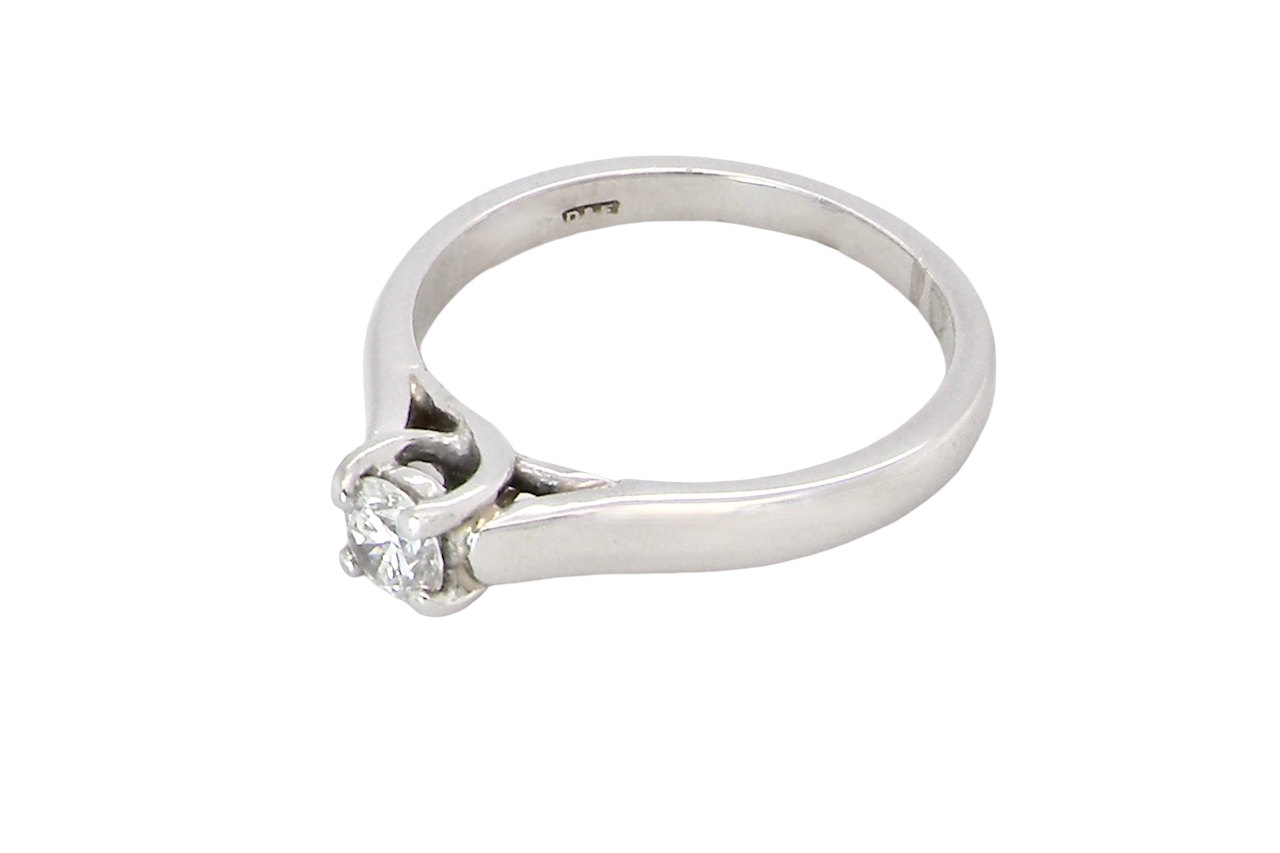 top view A single stone solitaire diamond ring. The modern brilliant cut white diamond measures 3.9mm (0.22 carats est) Colour G-h, clarity VS.