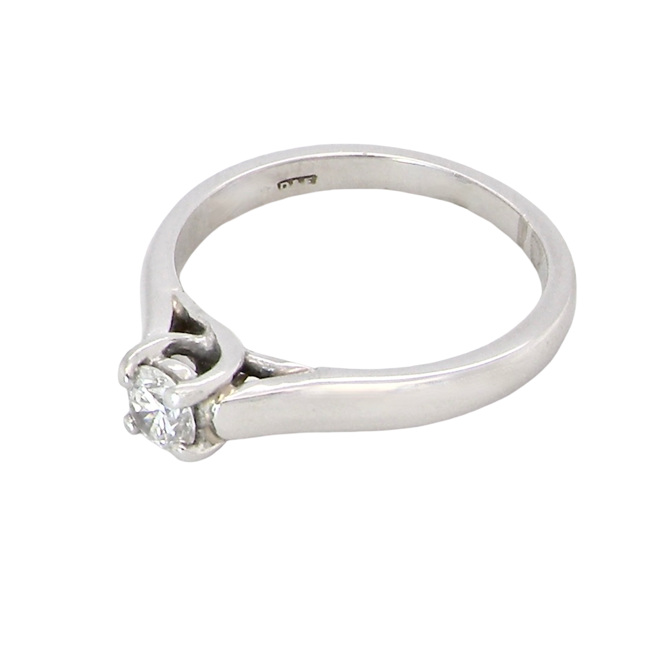top view A single stone solitaire diamond ring. The modern brilliant cut white diamond measures 3.9mm (0.22 carats est) Colour G-h, clarity VS.