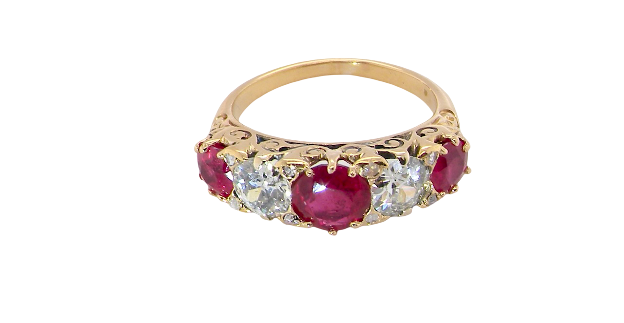 top view A superb Victorian ring, carved boat shaped head. Set with three fine rubies ,