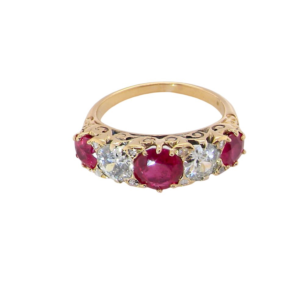 top view A superb Victorian ring, carved boat shaped head. Set with three fine rubies ,