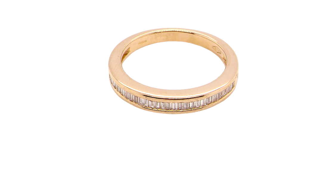 top view An 18 carat yellow gold half hoop eternity ring.
Set with thirty baguette cut white diamonds,