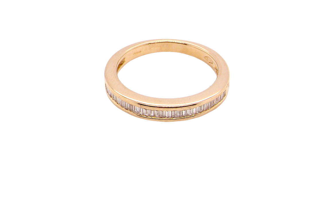 top view An 18 carat yellow gold half hoop eternity ring.
Set with thirty baguette cut white diamonds,