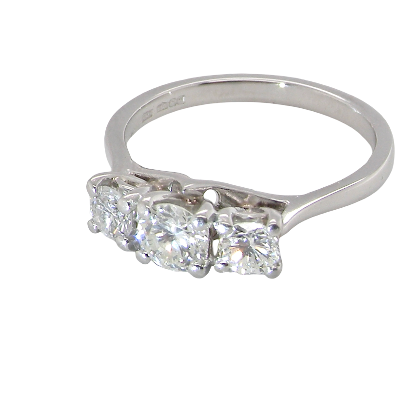 top view An exceptional three stone diamond trilogy ring, beautifully crafted in platinum and set with three modern brilliant cut white diamonds.