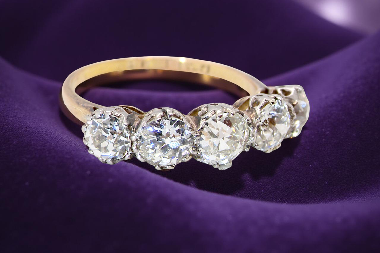 top view An impressive early 20th-century ring set with five old brilliant-cut white diamonds.