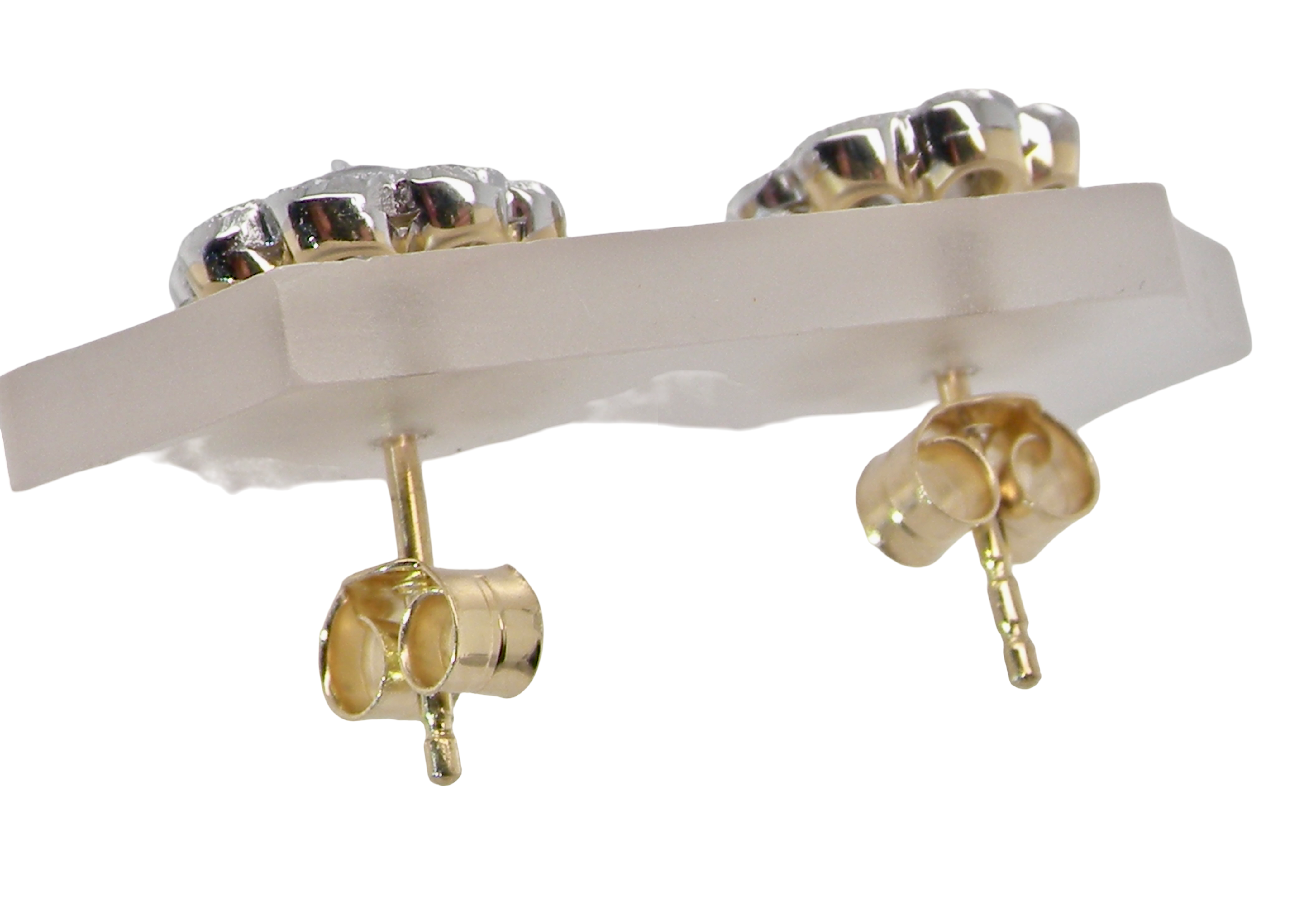 top view elegant pair of 18 carat gold* cluster earrings, each beautifully set with brilliant-cut white diamonds.