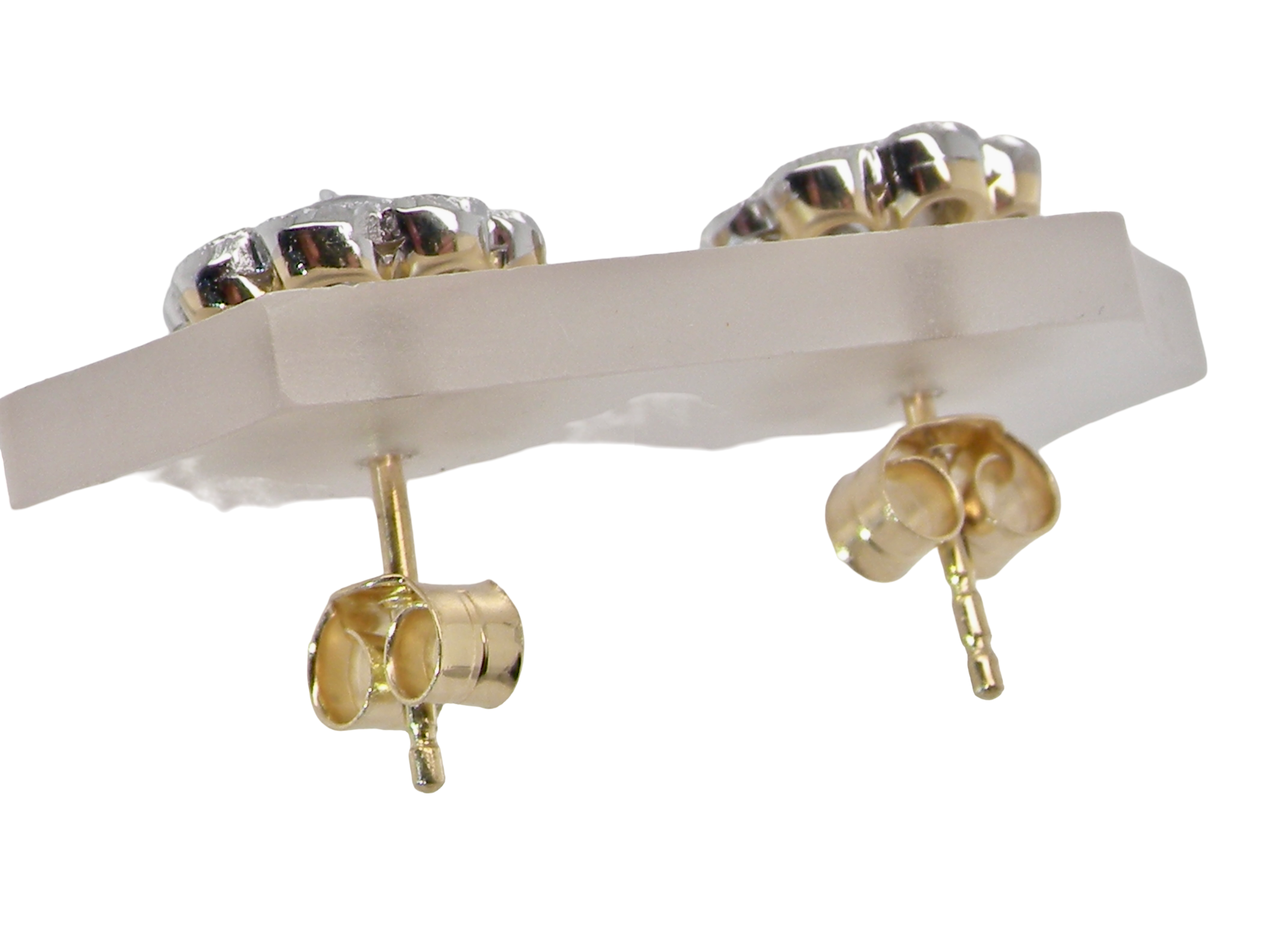 top view elegant pair of 18 carat gold* cluster earrings, each beautifully set with brilliant-cut white diamonds.