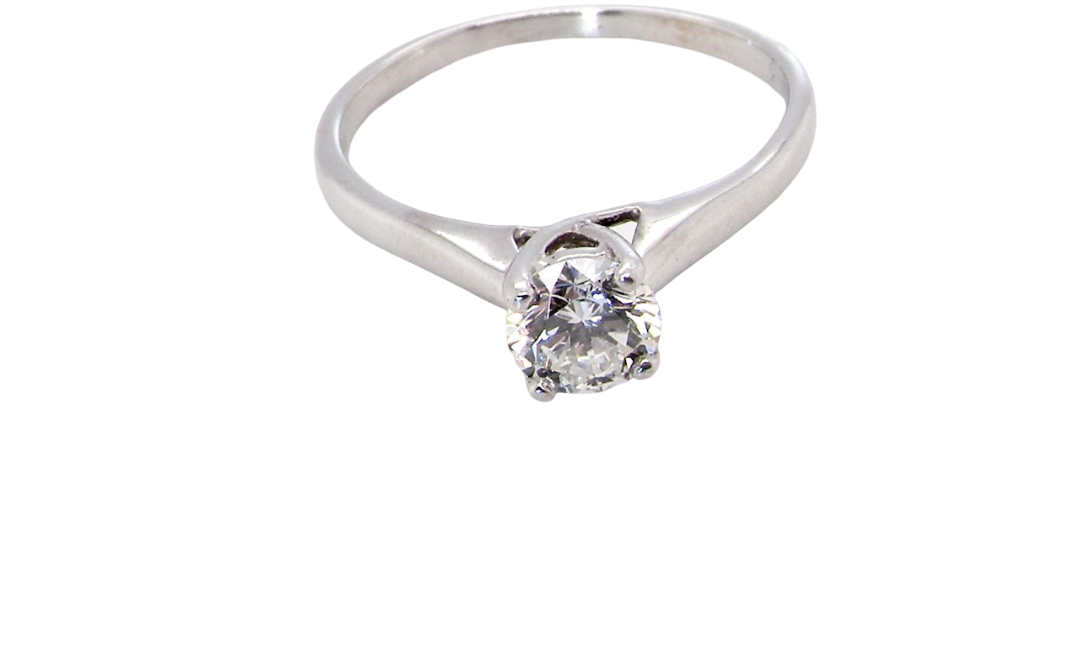 top view solitaire ring containing a fine modern brilliant cut white diamond. Measures 5.4mm (.53 carats)
Colour G-h, clarity Si. Modern feature under setting, depth 6.8mm, weight 2.6grams.