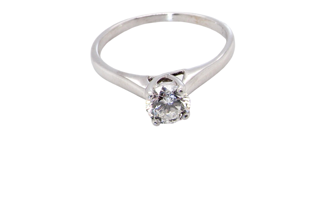 top view solitaire ring containing a fine modern brilliant cut white diamond. Measures 5.4mm (.53 carats)
Colour G-h, clarity Si. Modern feature under setting, depth 6.8mm, weight 2.6grams.