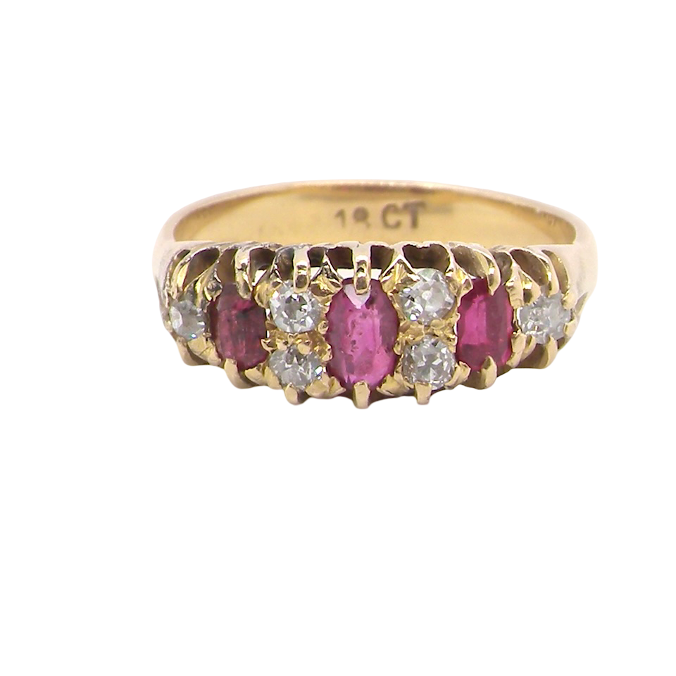 typical boat shaped ring from the late Victorian era, probably 1890-1900. This ring is set with three oval cut rubies,
