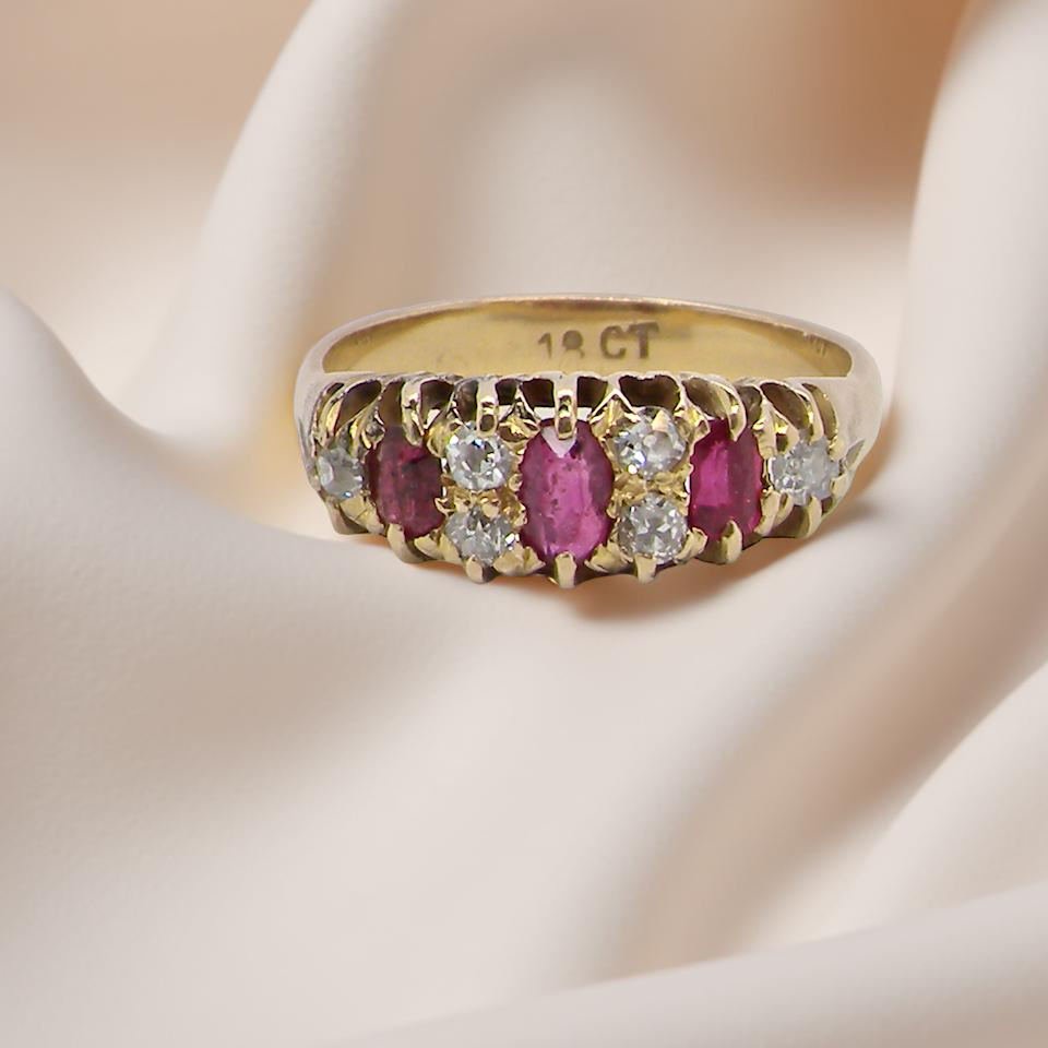 typical boat shaped ring from the late Victorian era, probably 1890-1900. This ring with three oval cut rubies,