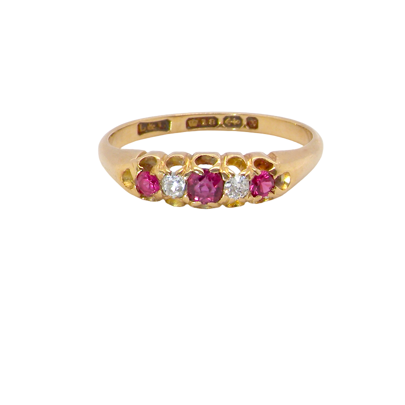 A vintage 18 carat gold three stone ring. Set with brilliant cut white diamonds, cente 3mm, each side a 2.4mm diamond (total est 0.20 carats) Colour I-j, clarity Si. 
