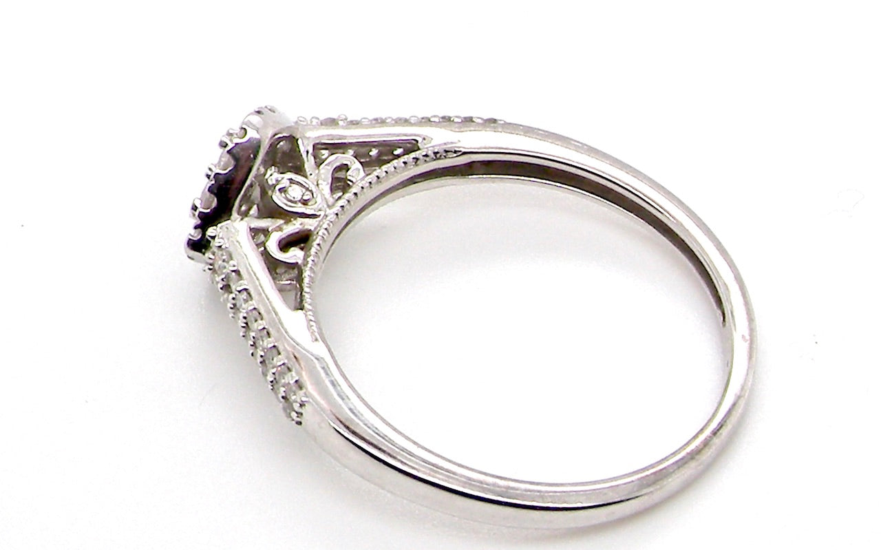 A 9 carat white gold diamond cluster ring side view