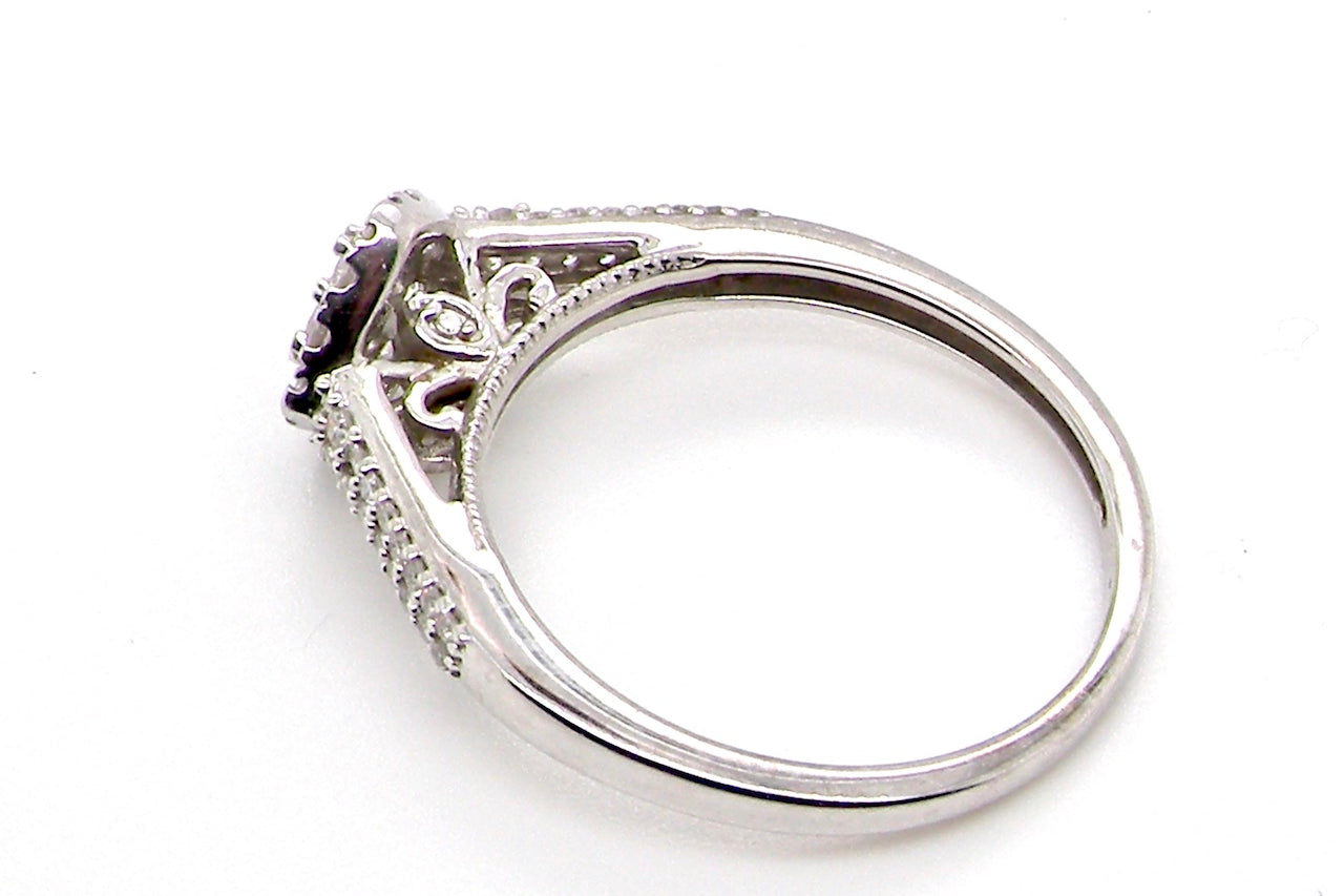 A 9 carat white gold diamond cluster ring side view