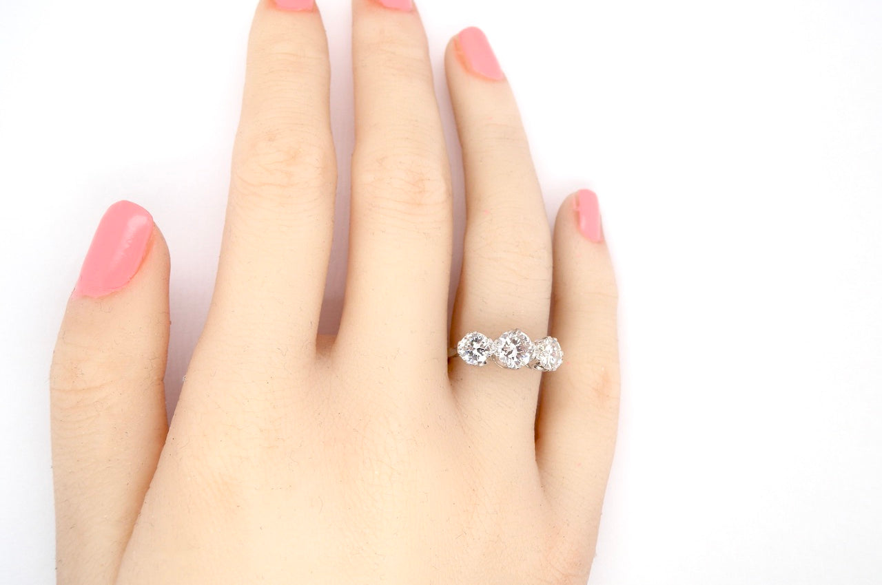 Diamond trilogy engagement ring