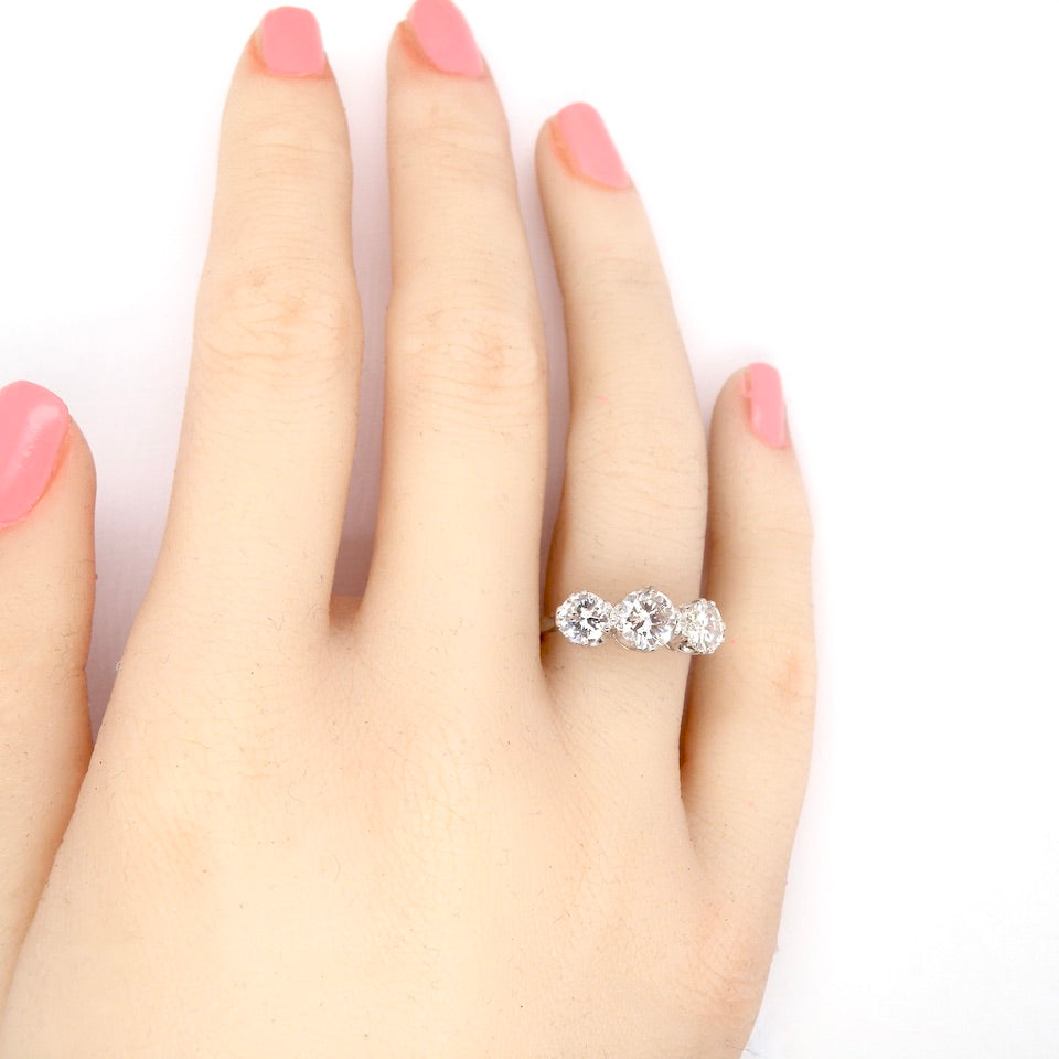 Diamond trilogy engagement ring