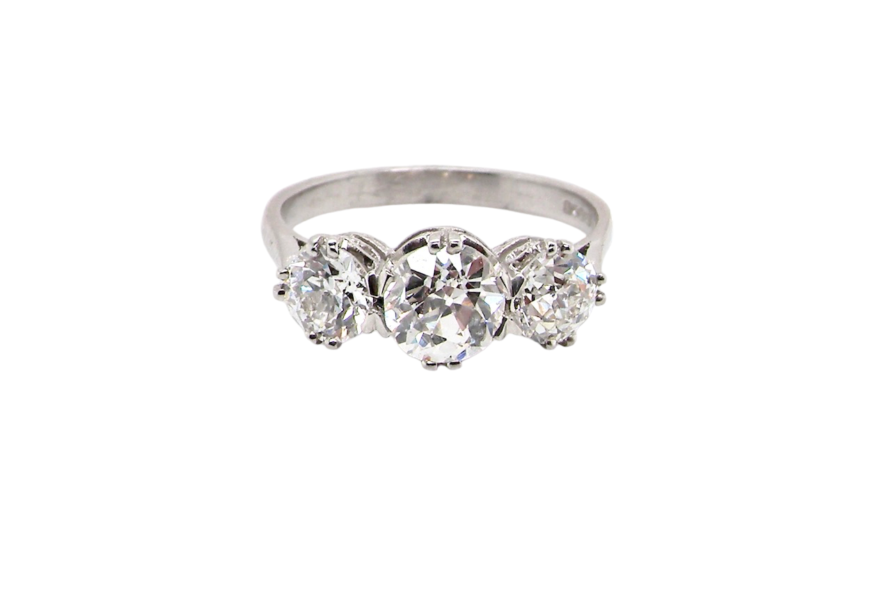 Vintage three stone platinum diamond ring