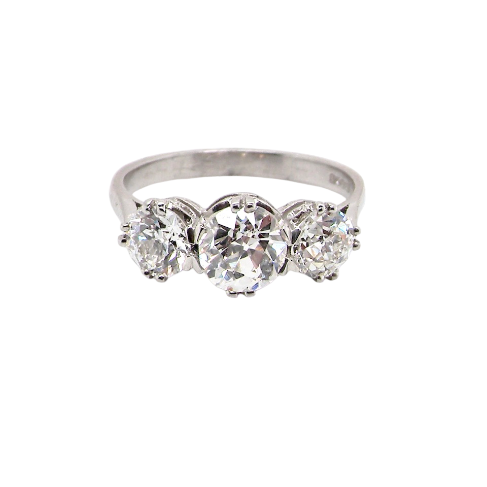 Vintage three stone platinum diamond ring