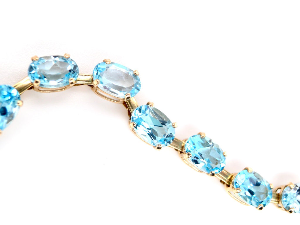 gold blue topaz line bracelet