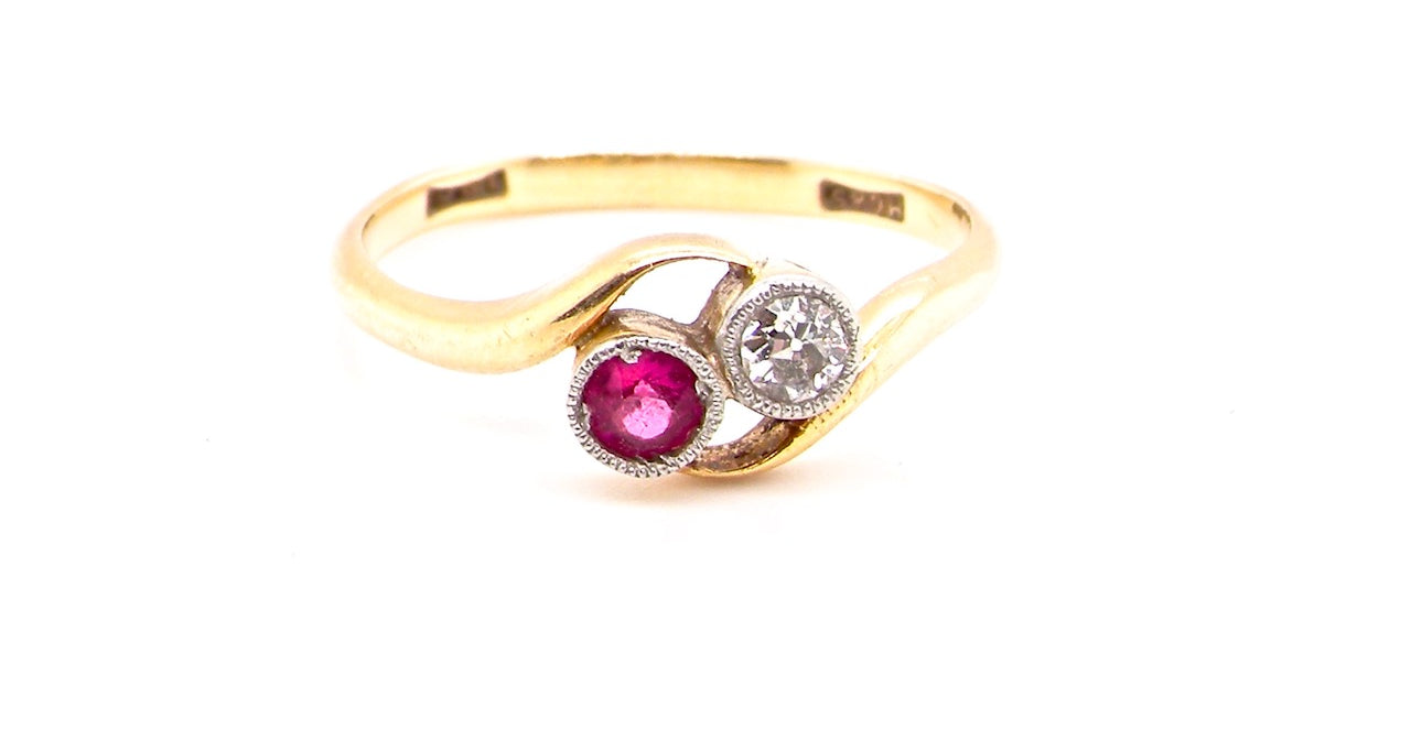 vintage two stone ruby and diamond cross over ring