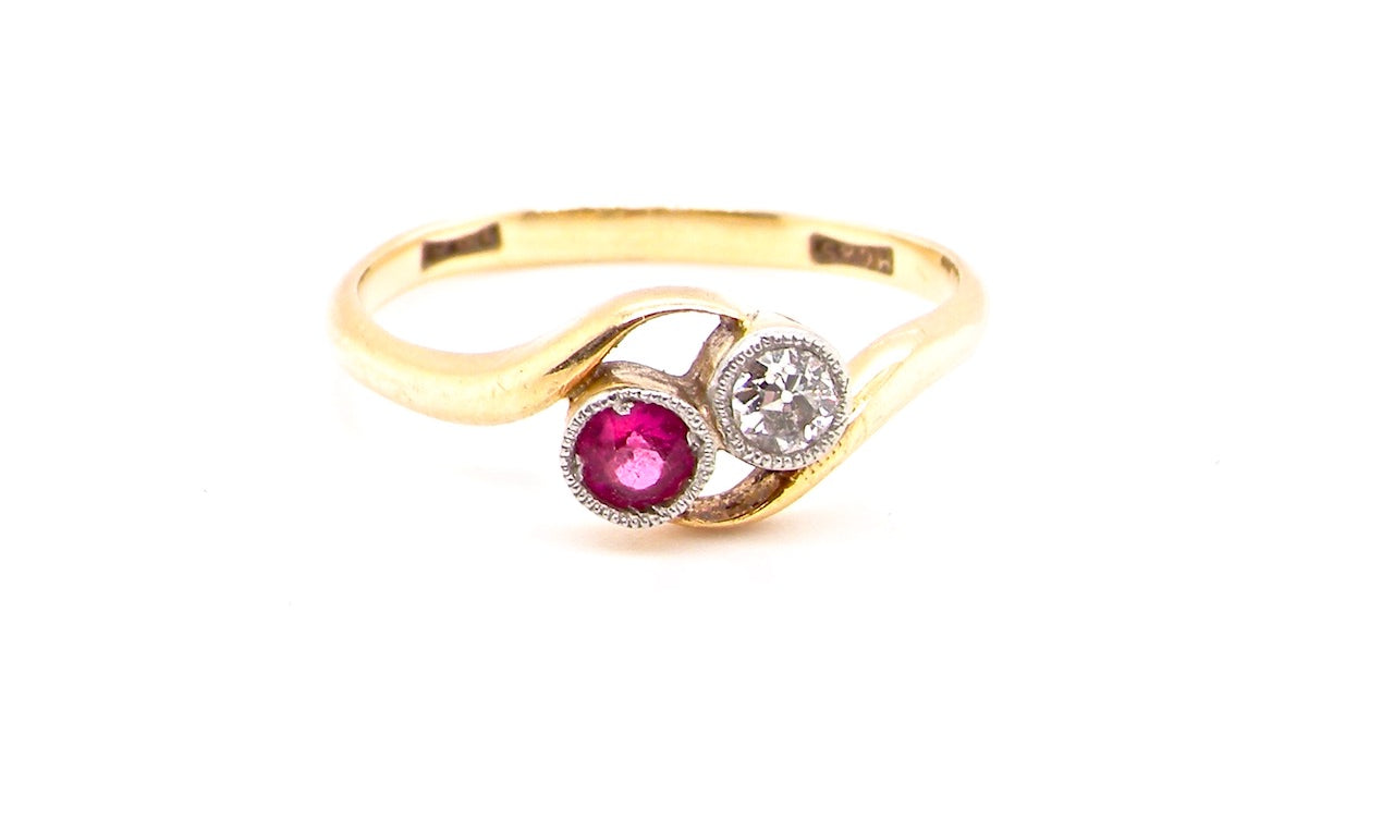 vintage two stone ruby and diamond cross over ring