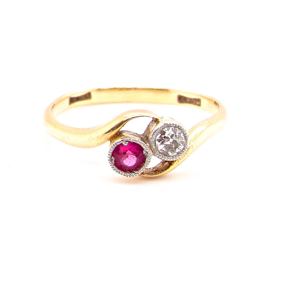 vintage two stone ruby and diamond cross over ring