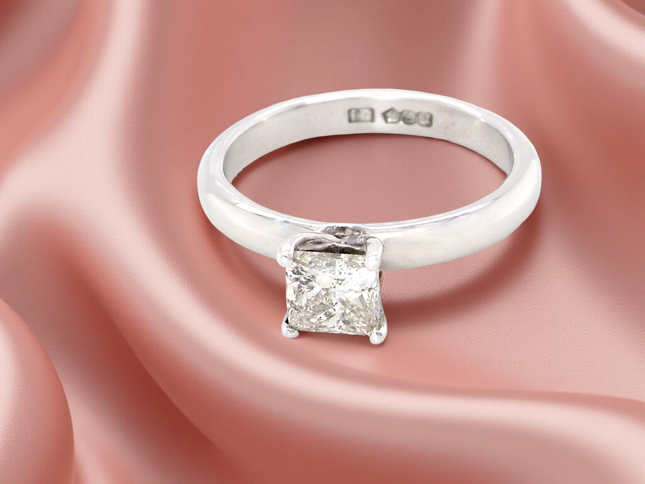  solitaire ring featuring a stunning 0.78 carat Princess-cut white diamond 