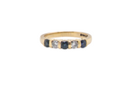 18-carat gold half-hoop eternity ring, set with&nbsp;three round mid-blue sapphires