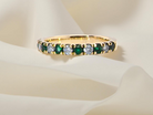 18 carat gold half-hoop eternity ring, set with&nbsp;six round-cut emeralds