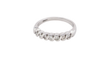 18 carat white gold half hoop eternity ring. Set with seven brilliant cut white diamonds,