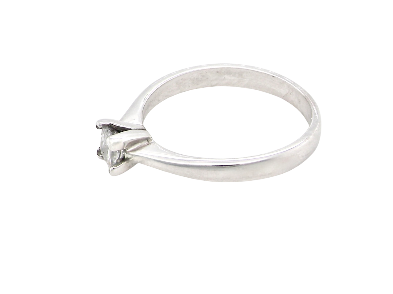An 18 carat white gold solitaire ring that features a Princess Cut white diamond. Measures 4x4mm,&nbsp; (est 0.30 carats). Colour I-j, clarity Si
