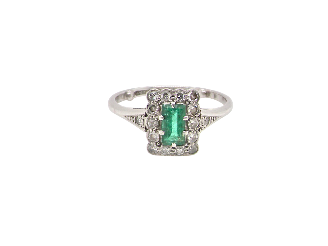 A vintage Emerald and Diamond Cluster ring