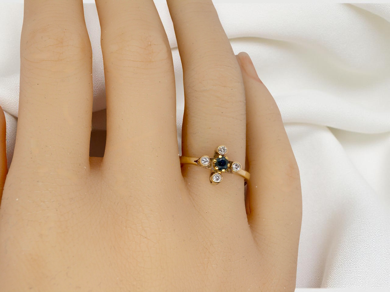 A 9 carat gold sapphire and diamond ring