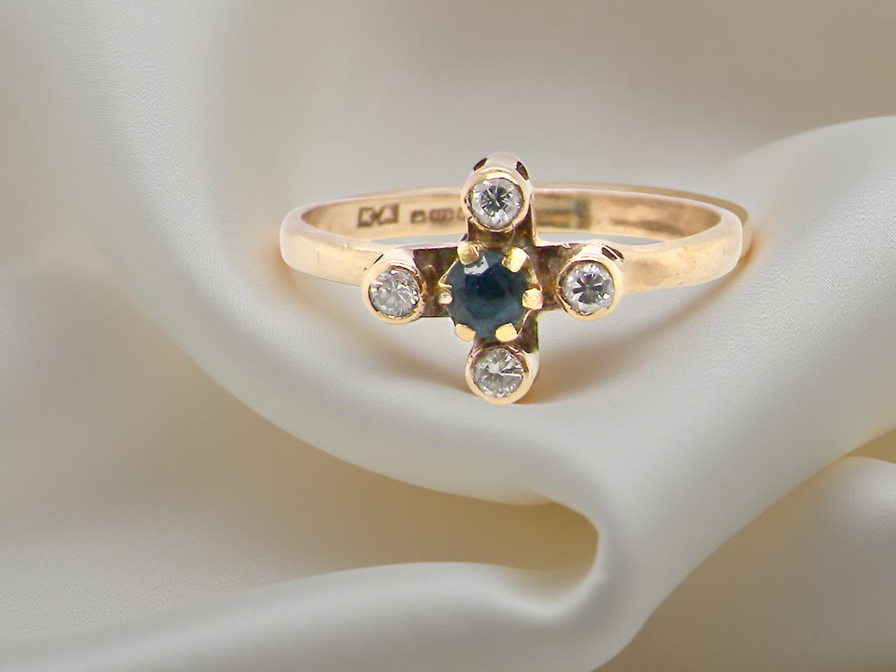 A 9 carat gold sapphire and diamond ring