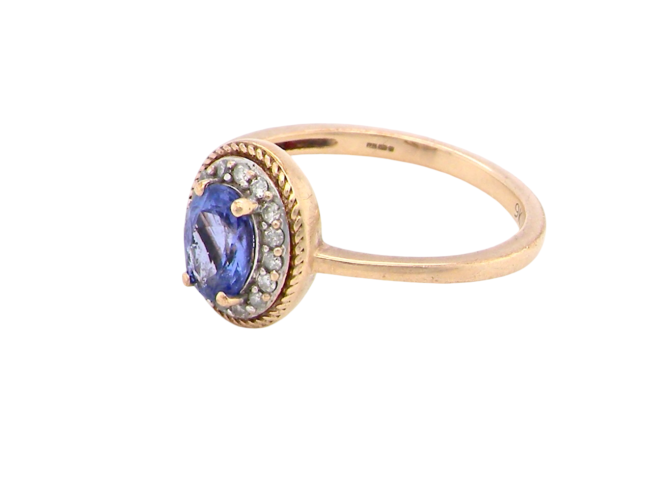 9 carat gold cluster ring. Features to the centre an oval cut tanzanite gem stone. Measures 7x5mm, four claw setting.