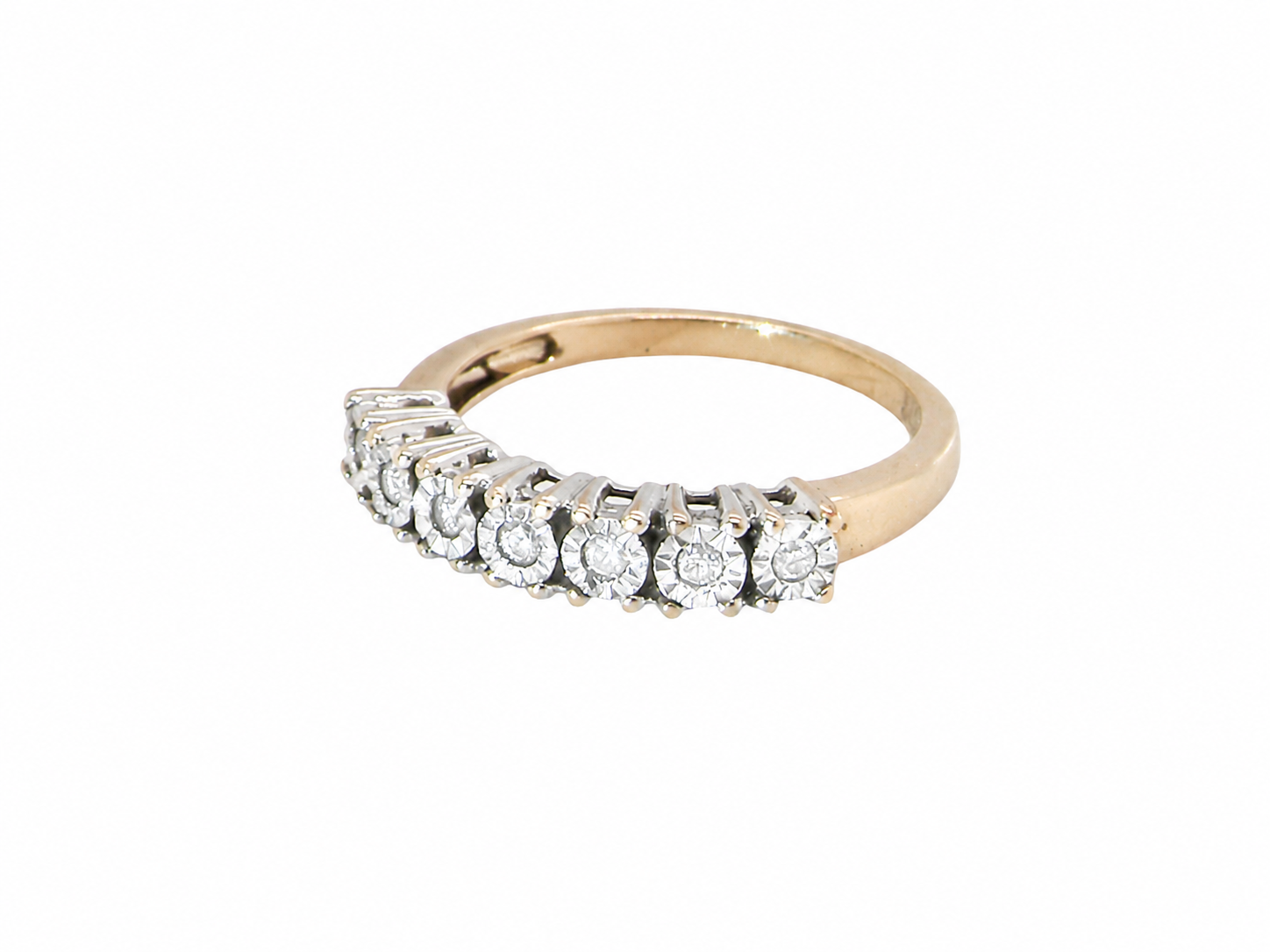  9 carat gold  eternity ring.

Set with seven small white diamonds, each 1.8mm within an illusion setting that is 3.8mm in diameter, and white gold.&nbsp;
 