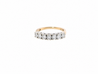  9 carat gold half hoop eternity ring.

Set with seven small white diamonds, each 1.8mm within an illusion setting that is 3.8mm in diameter, and white gold.&nbsp;
 