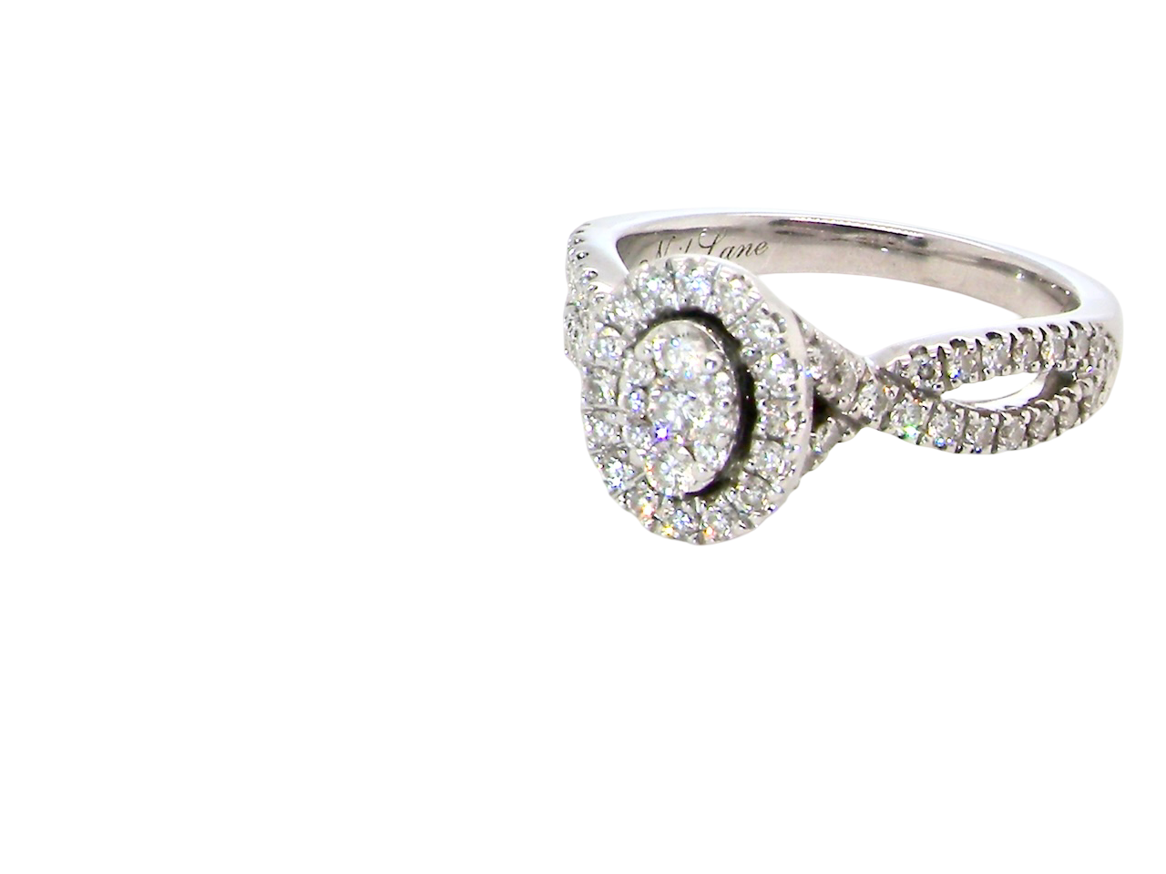 A 14 carat white gold cluster ring. The centre cluster an oval setting with nine small white diamonds.&nbsp;

Around the outside a halo of sixteen smaller diamonds,  side