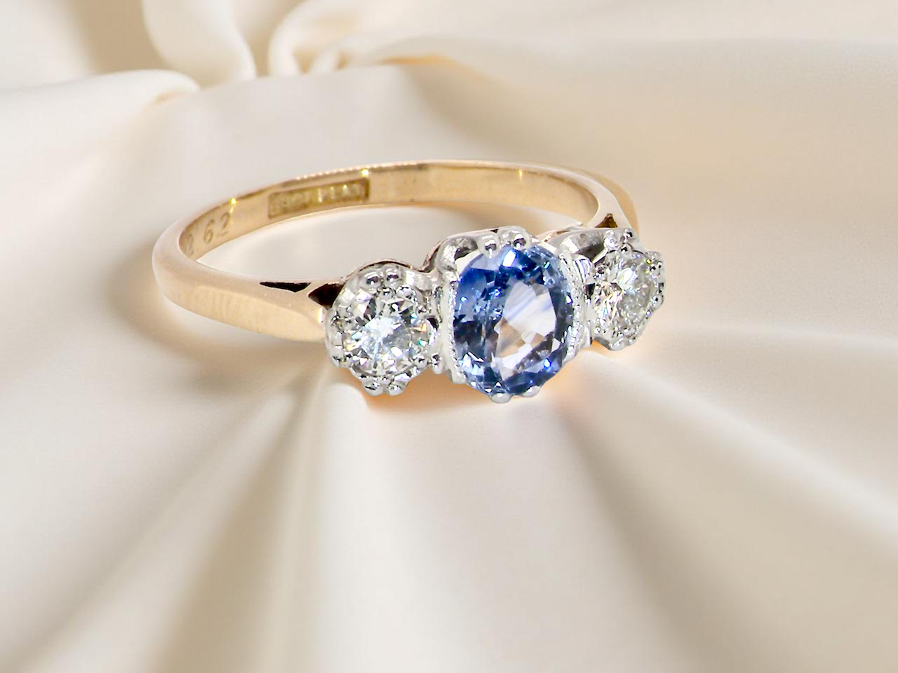 A 3 stone sapphire and diamond ring-C