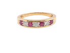 A seven stone Ruby and Diamond eternity ring