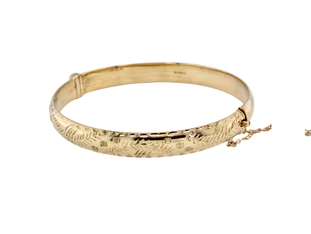 A gold hinged bangle