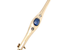 A 9 carat gold bar brooch, width 55mm. Set with a  sapphire,