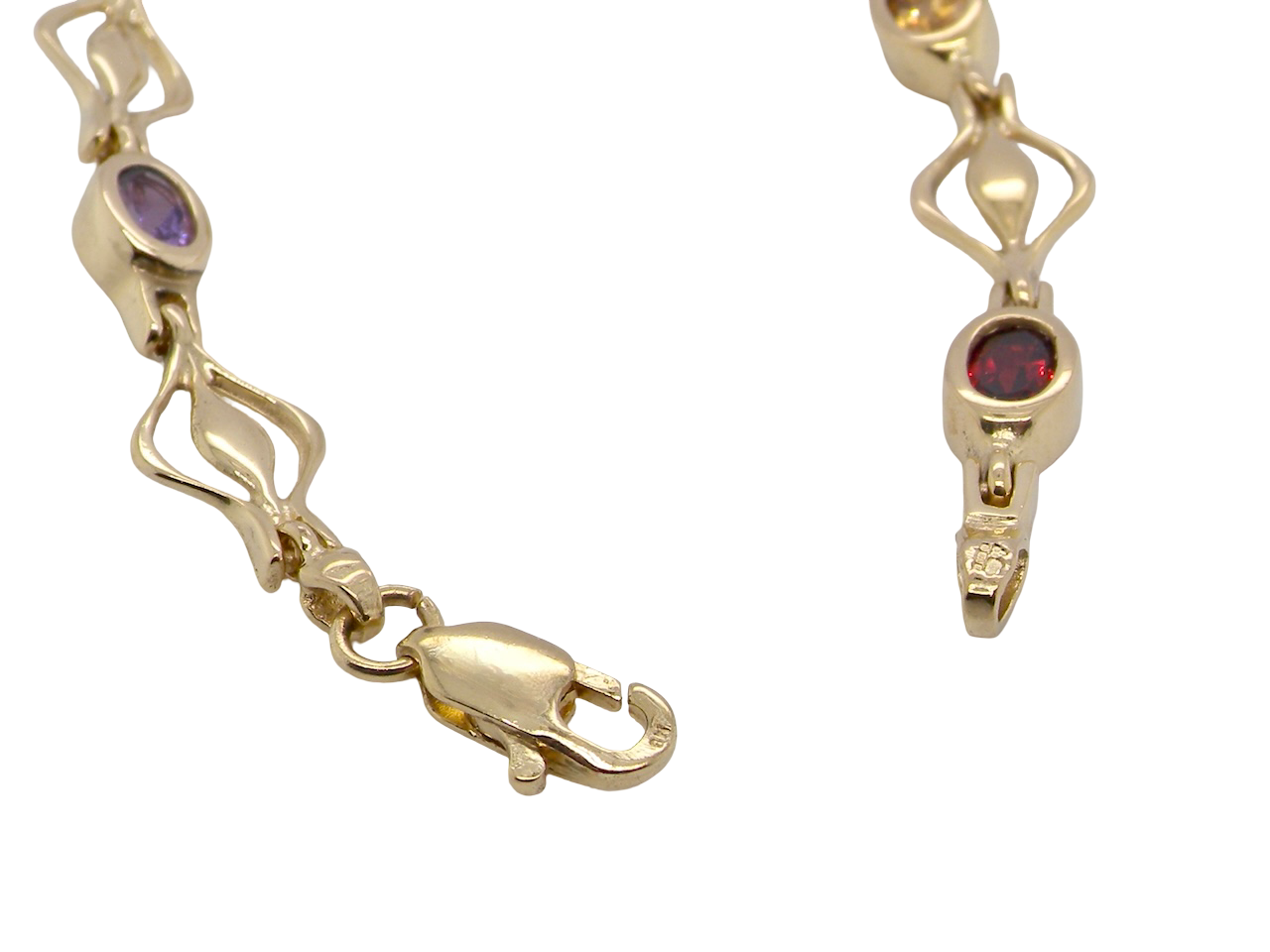 A 9 carat gold bracelet. Set with various gemstones, 
