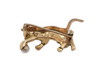 A 9 carat gold brooch in the shape of a cat chasing a ball. Rear