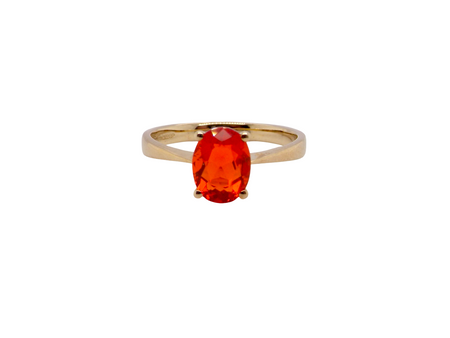 A 9 carat gold dress ring that features a vibrant fireglow fire opal. The bright orange colour is quite beautiful.